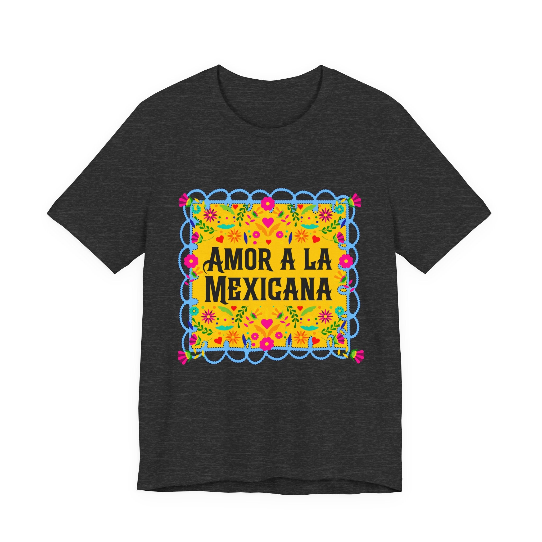 Close-up of a premium graphic t-shirt with vibrant Mexican floral artwork and "Amor a la Mexicana" typography.