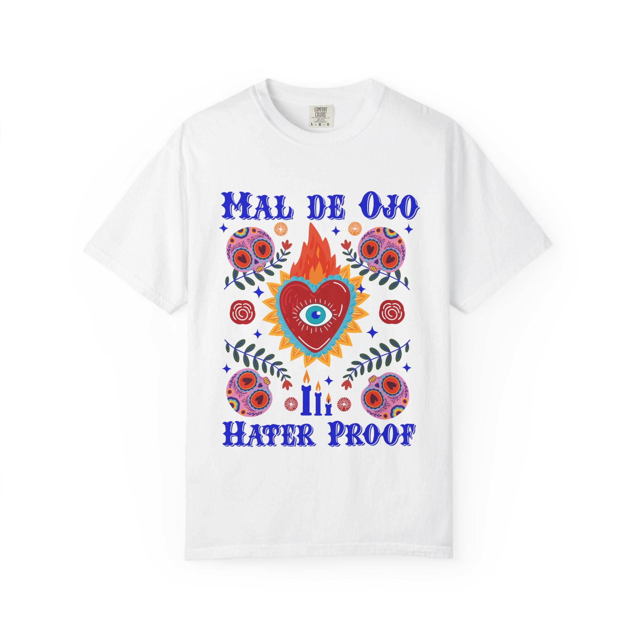 Heavyweight T-shirt featuring a colorful Sacred Heart graphic, a protective eye, and the phrase “Mal de Ojo Hater Proof.”