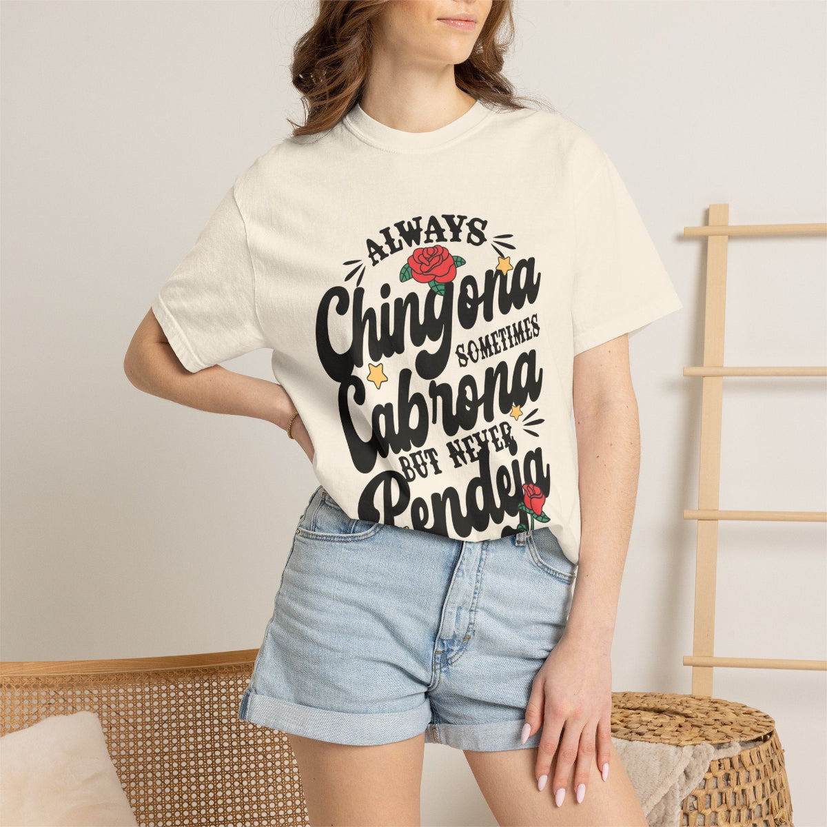 vintage-style t-shirt with "Always Chingona Sometimes Cabrona" floral typography by Chingonas Social Club.