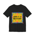 T-shirt with pink "Amor a la Mexicana" text surrounded by a colorful floral frame inspired by Mexican folk art.