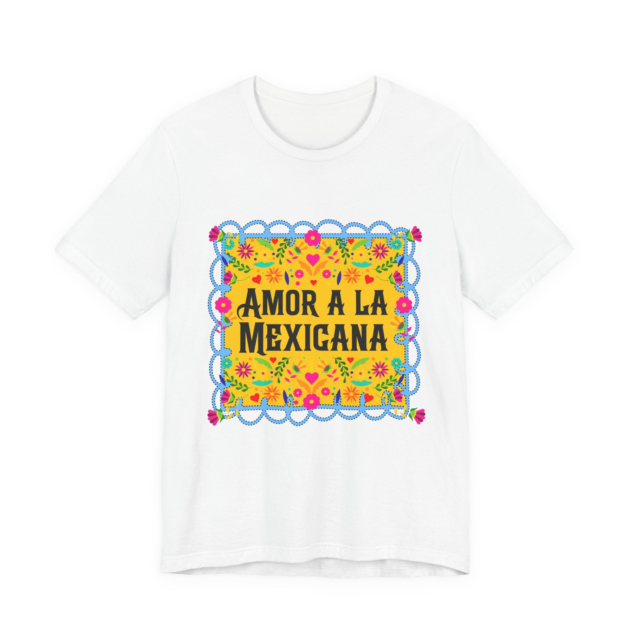 Close-up of a premium white graphic t-shirt with vibrant Mexican floral artwork and "Amor a la Mexicana" typography.