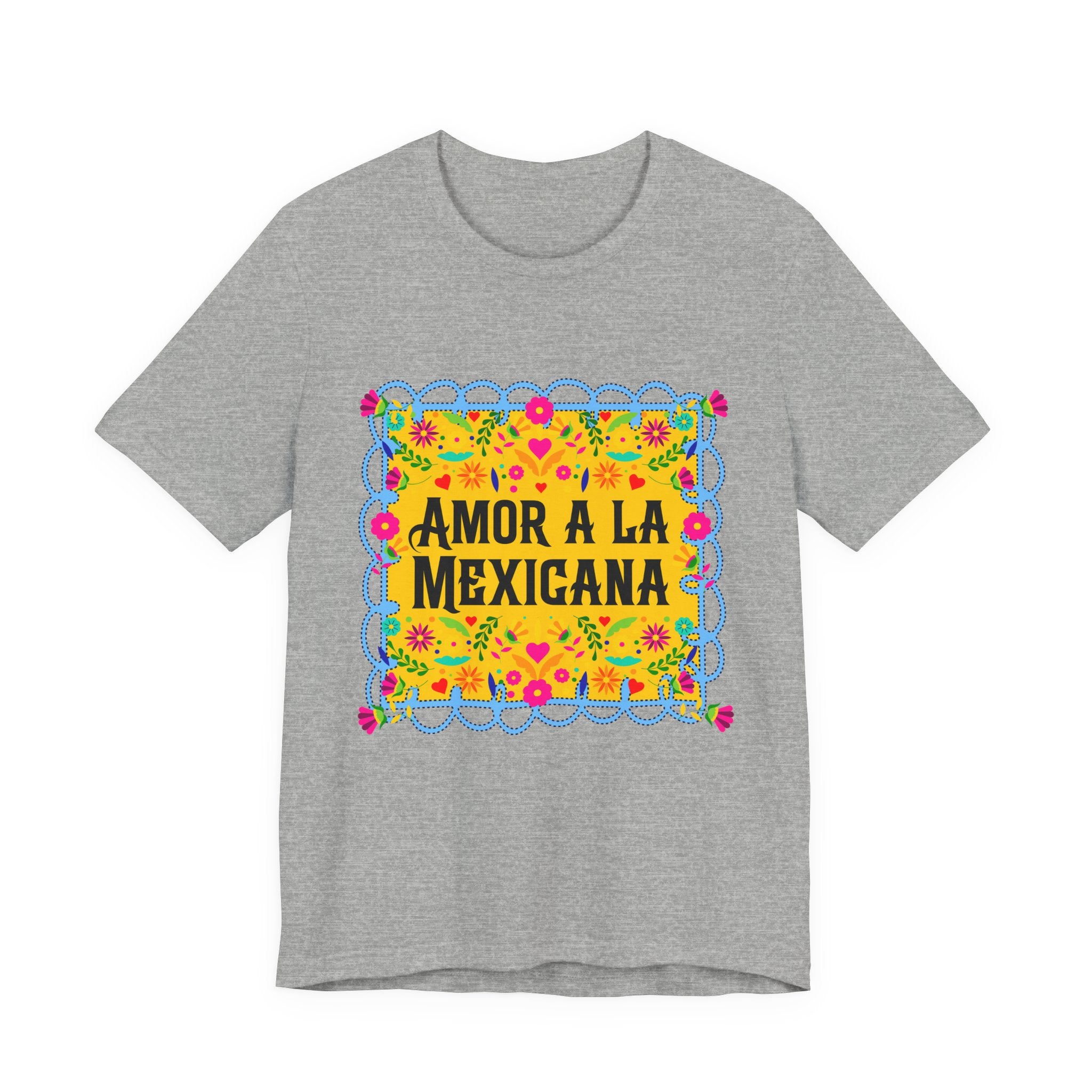 Close-up of a premium graphic t-shirt with vibrant Mexican floral artwork and "Amor a la Mexicana" typography.