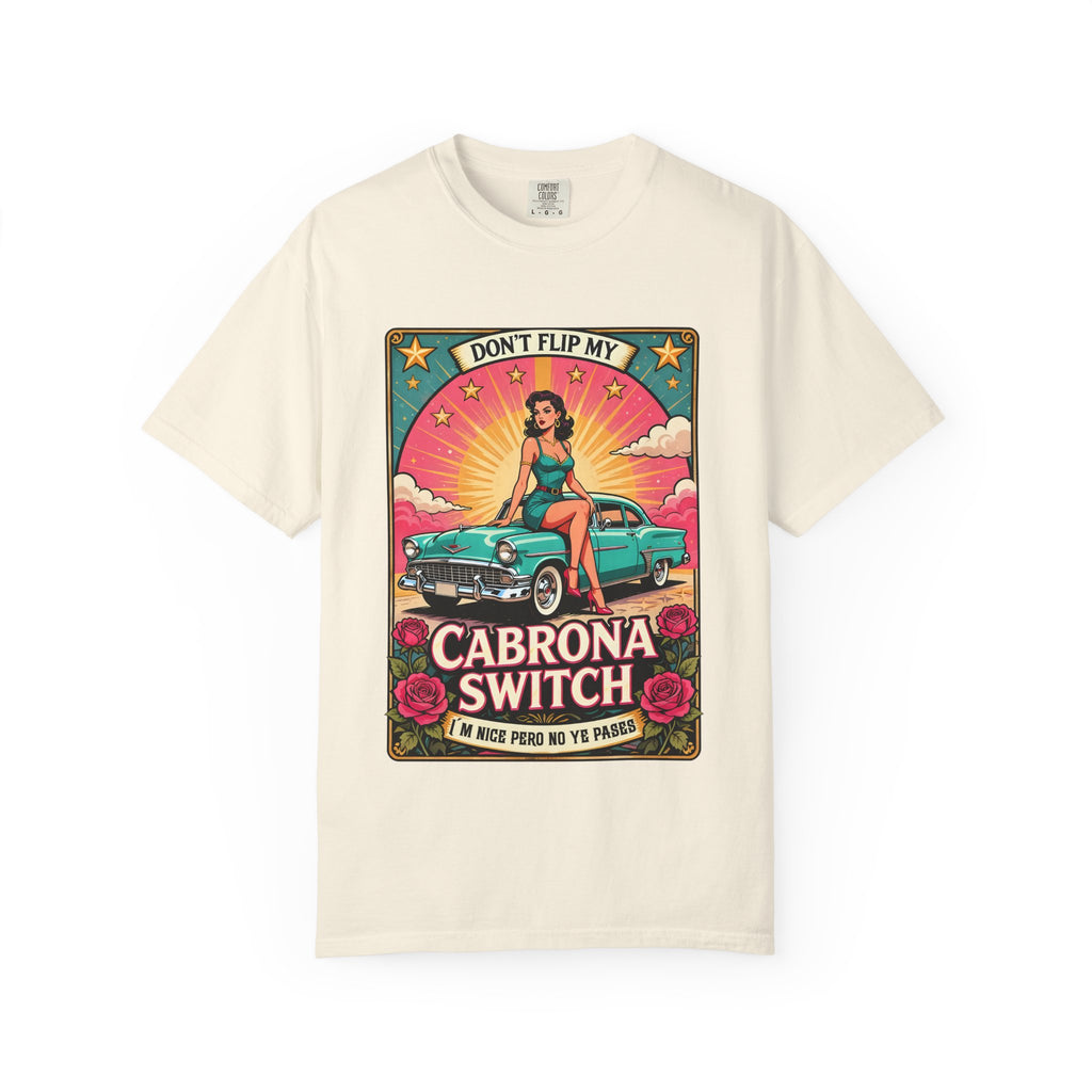 vintage-style t-shirt featuring a pin-up woman sitting on a turquoise lowrider car with roses and the text Cabrona Switch.