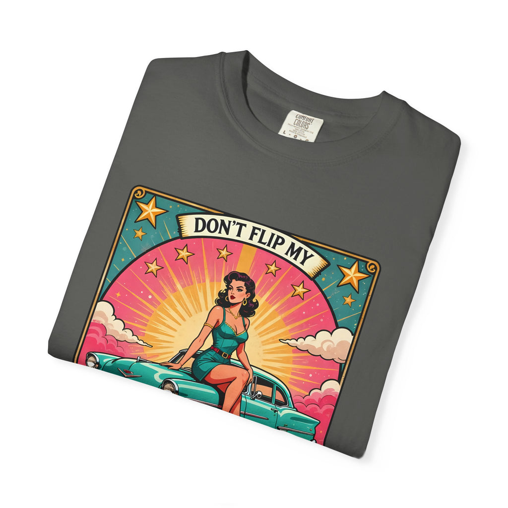vintage-style t-shirt featuring a pin-up woman sitting on a turquoise lowrider car with roses and the text Cabrona Switch.
