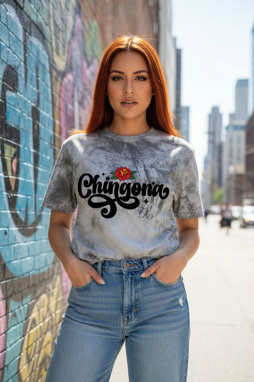 A stunning calligraphic font featuring a delicate rose design on a vintage tie-dye T-shirt.
