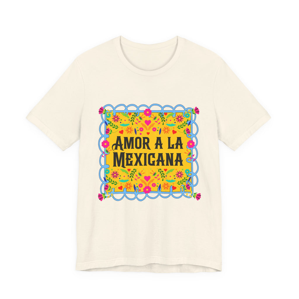 Close-up of a premium graphic t-shirt with vibrant Mexican floral artwork and "Amor a la Mexicana" typography.