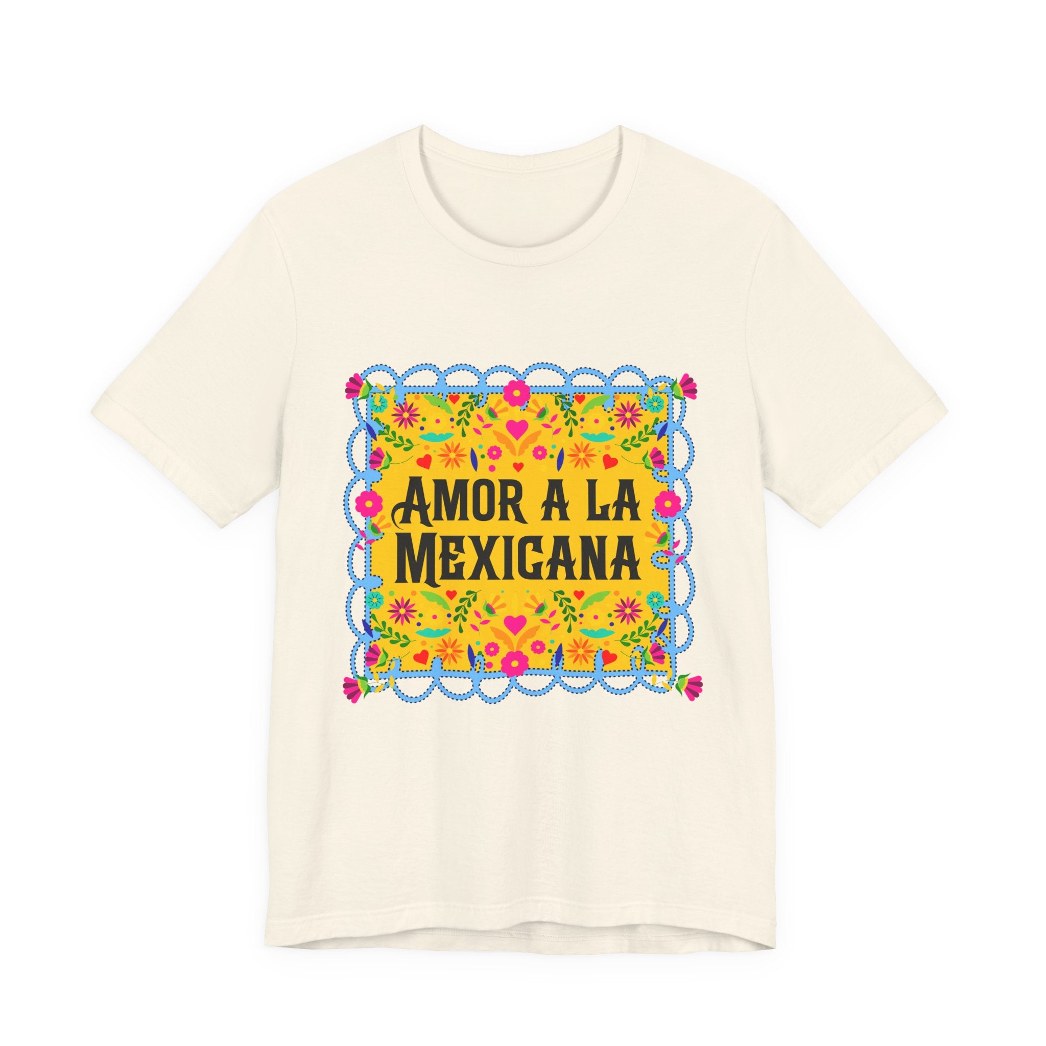 Close-up of a premium graphic t-shirt with vibrant Mexican floral artwork and "Amor a la Mexicana" typography.