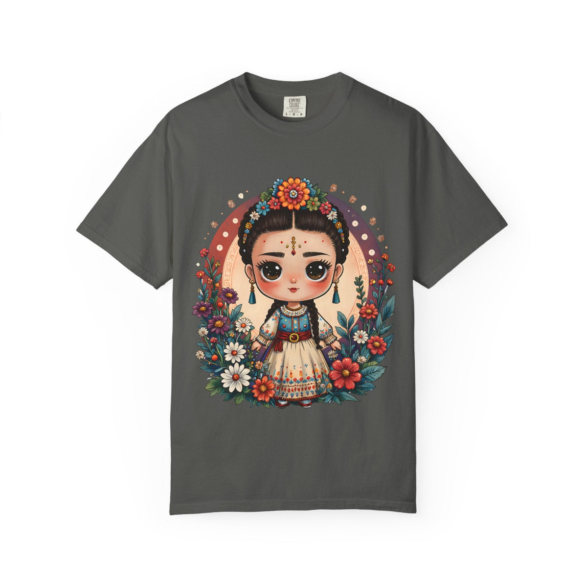 Whimsical Mexican folk art doll with floral crown and celestial accents on a heavyweight cotton t-shirt.