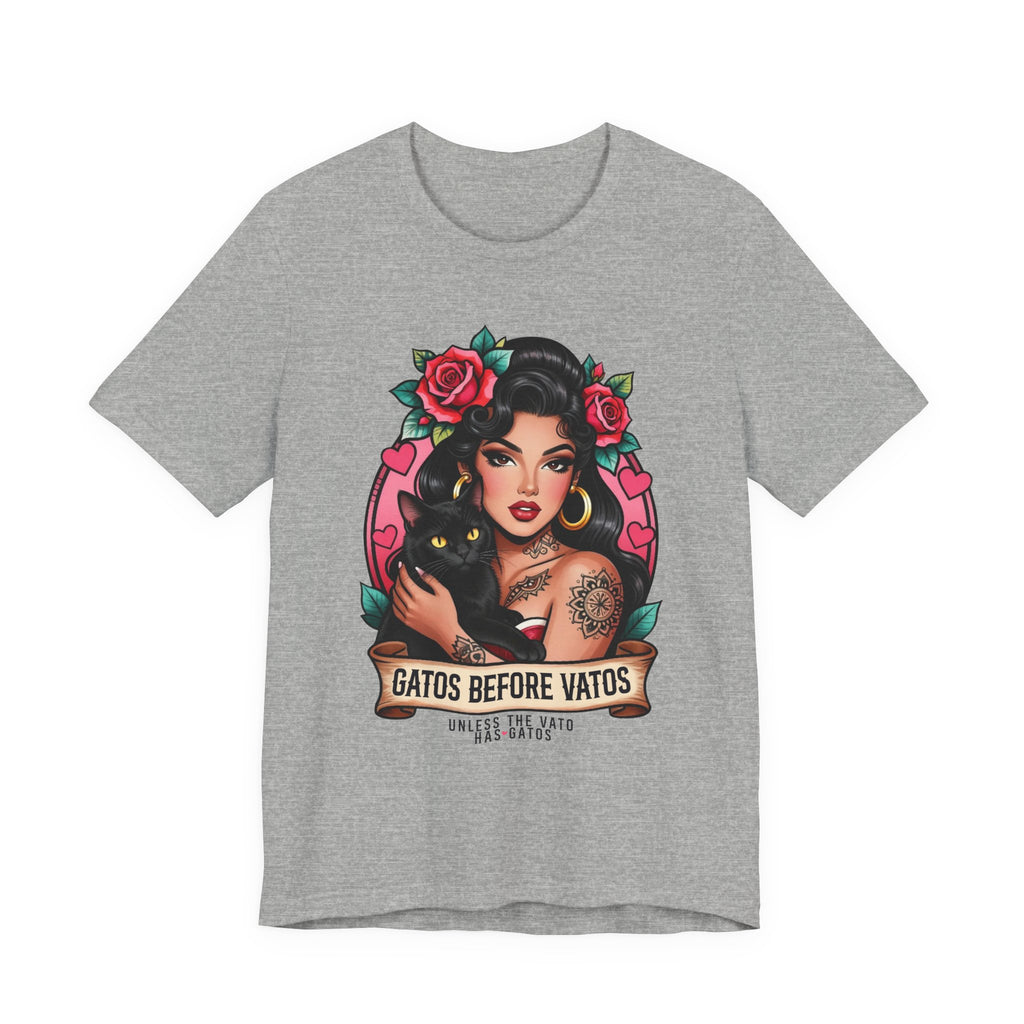 Latina model wearing a grey Gatos Before Vatos shirt with a tattooed woman and black cat illustration.