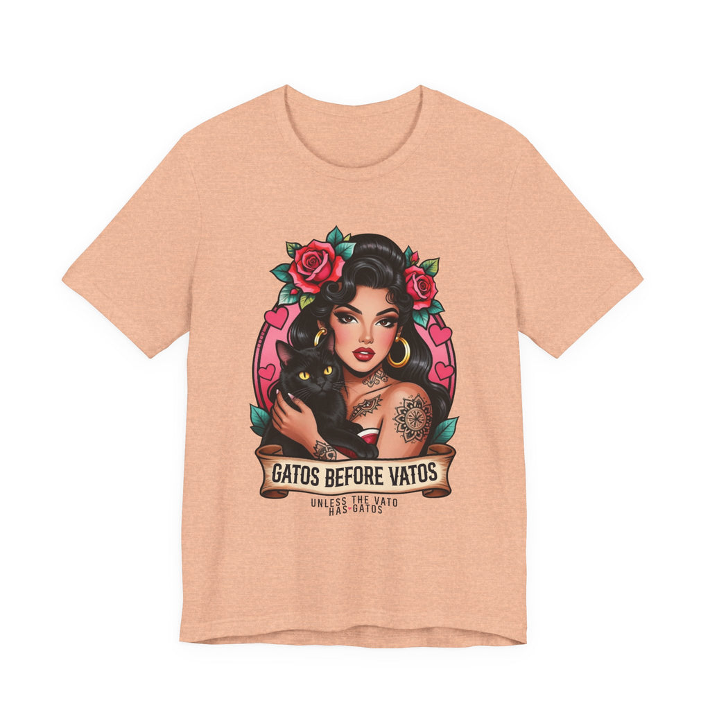 Latina model wearing a grey Gatos Before Vatos shirt with a tattooed woman and black cat illustration.