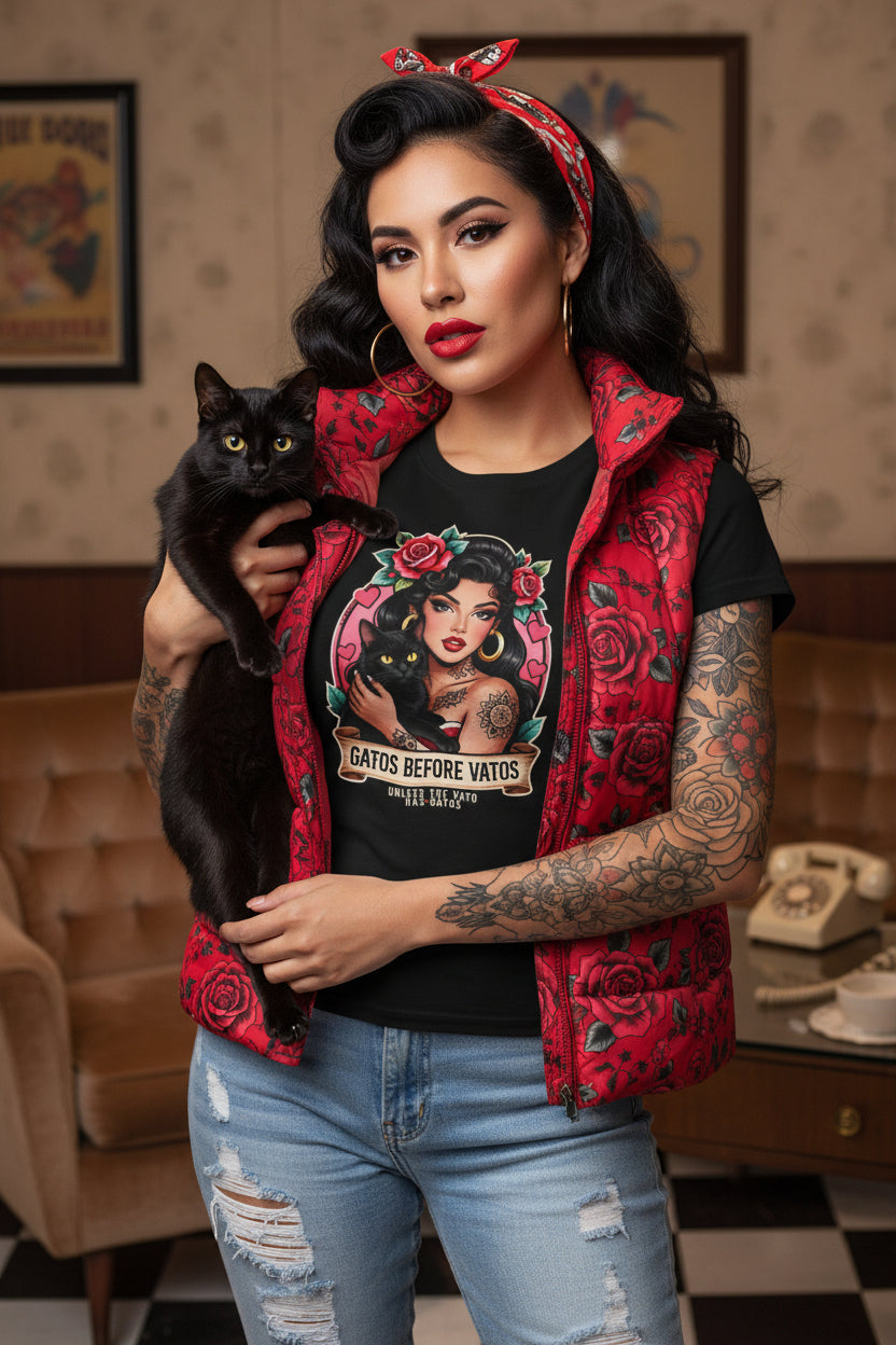 Latina model wearing a grey Gatos Before Vatos shirt with a tattooed woman and black cat illustration.