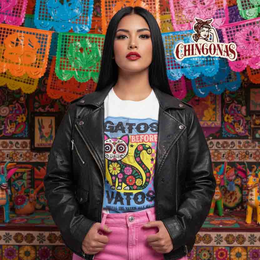 t-shirt featuring a colorful Day of the Dead cat with flowers and the phrase Gatos Before Vatos.