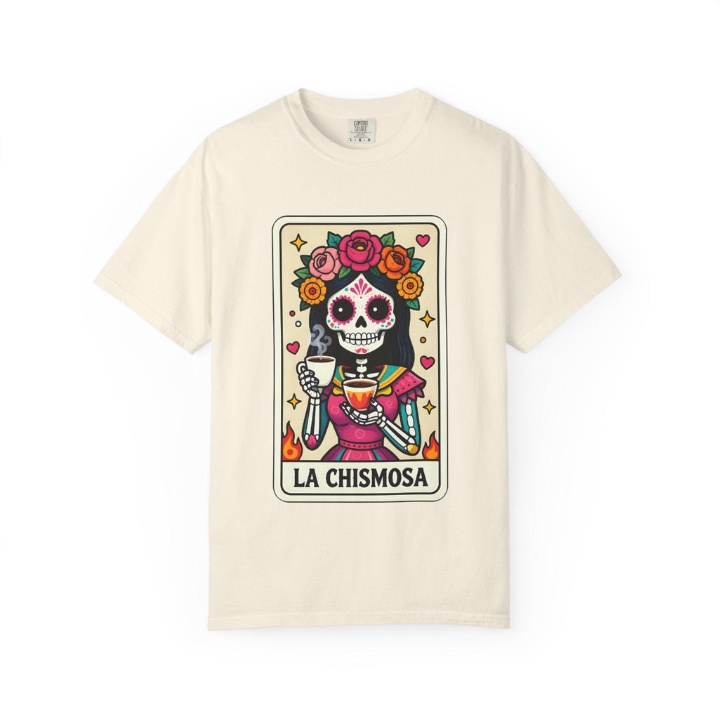 Vintage lotería card design on a t-shirt featuring a sugar skull calavera holding a coffee cup with the text La Chismosa.