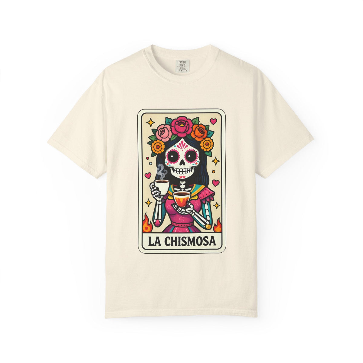 Vintage lotería card design on a t-shirt featuring a sugar skull calavera holding a coffee cup with the text La Chismosa.