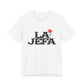 T-shirt with bold black text reading LA JEFA and a small red rose graphic, representing Latina leadership.