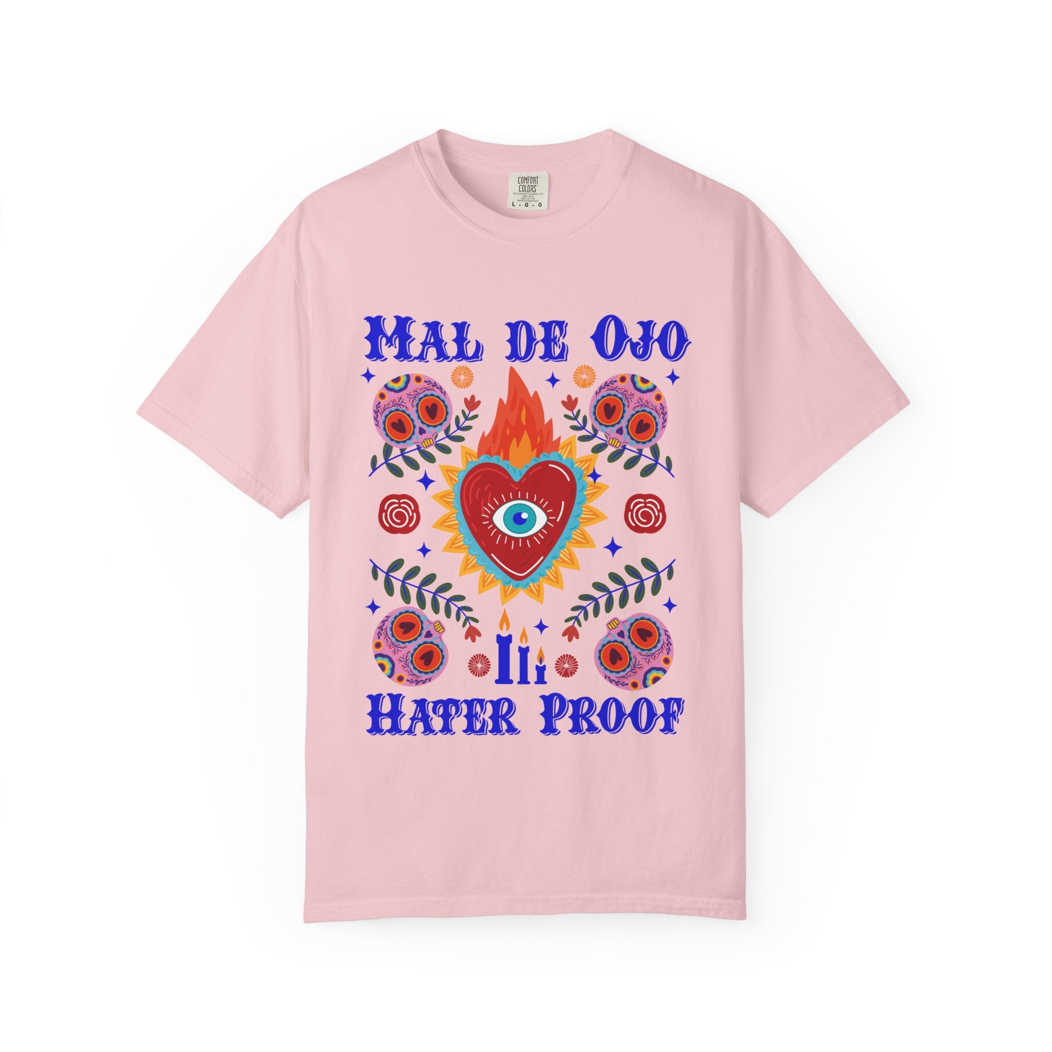 Heavyweight T-shirt featuring a colorful Sacred Heart graphic, a protective eye, and the phrase “Mal de Ojo Hater Proof.”