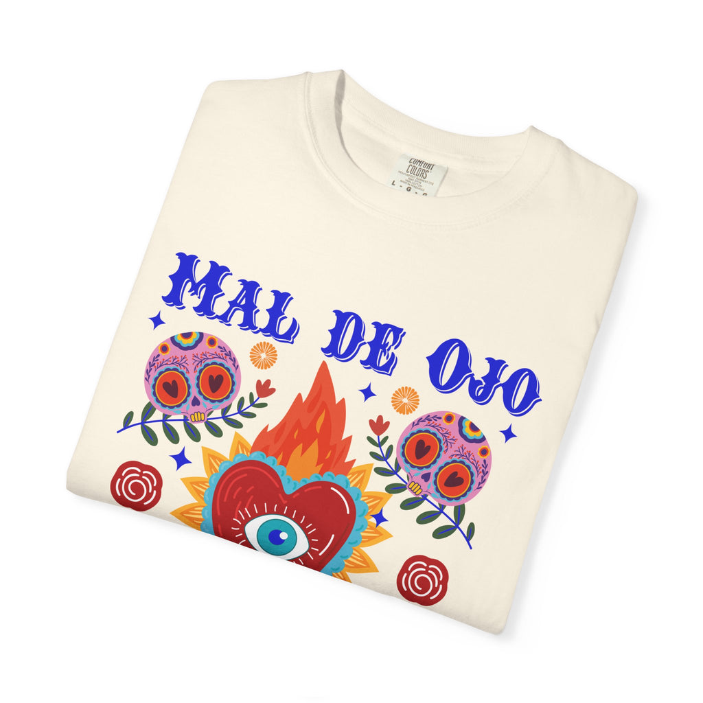 Heavyweight T-shirt featuring a colorful Sacred Heart graphic, a protective eye, and the phrase “Mal de Ojo Hater Proof.”