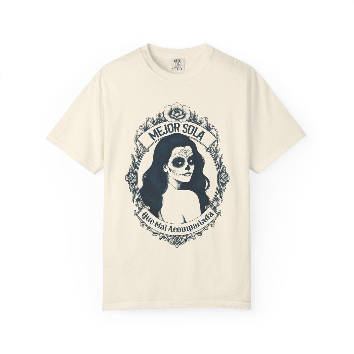 A detailed graphic print of a vintage-style Mexican calavera silhouette featuring the text “Mejor Sola Que Mal Acompañada” on a heavyweight Comfort Colors shirt.
