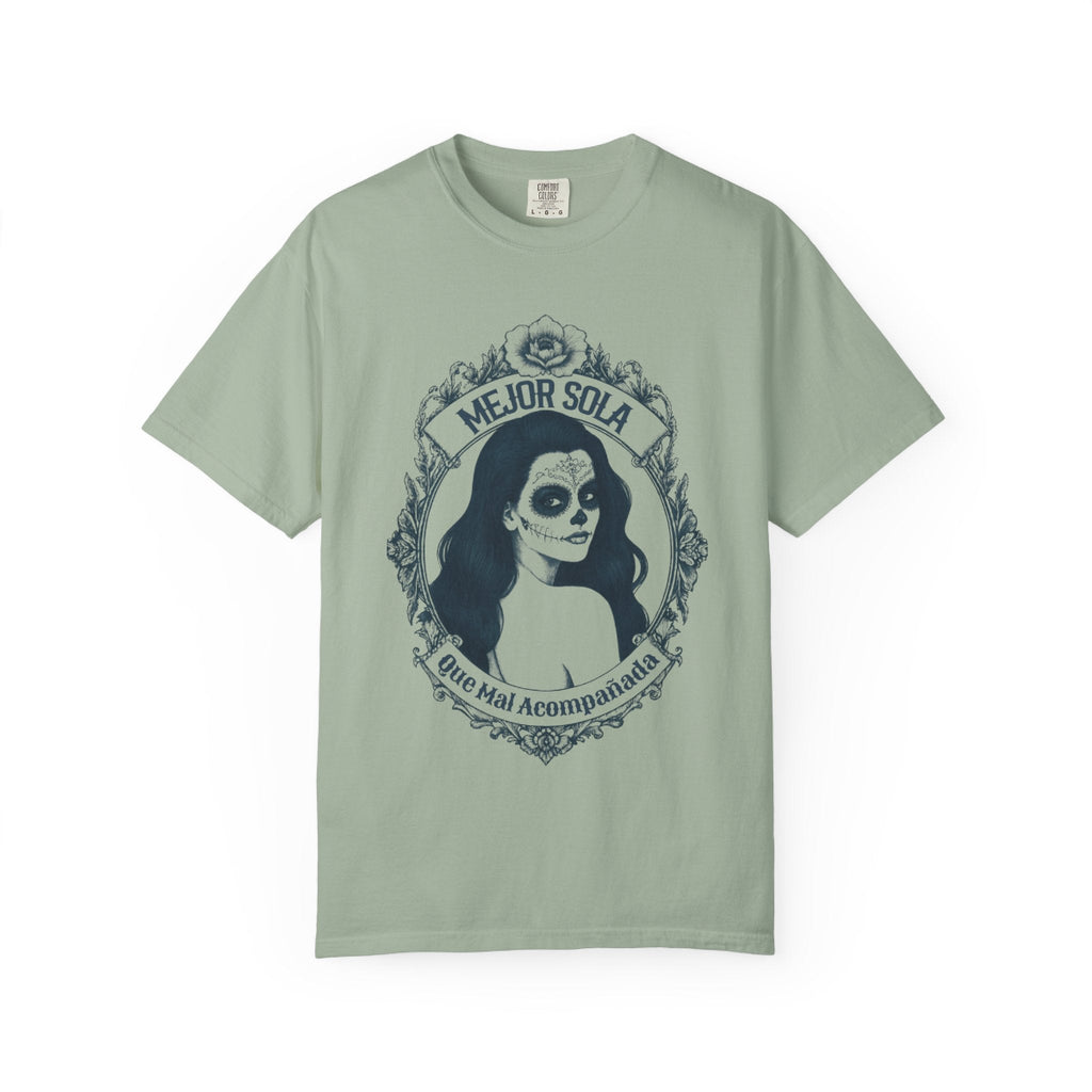 A detailed graphic print of a vintage-style Mexican calavera silhouette featuring the text “Mejor Sola Que Mal Acompañada” on a heavyweight Comfort Colors shirt.