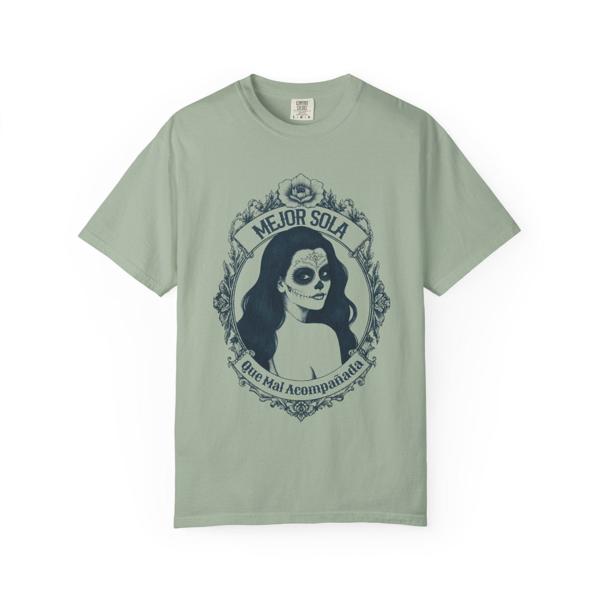 A detailed graphic print of a vintage-style Mexican calavera silhouette featuring the text “Mejor Sola Que Mal Acompañada” on a heavyweight Comfort Colors shirt.